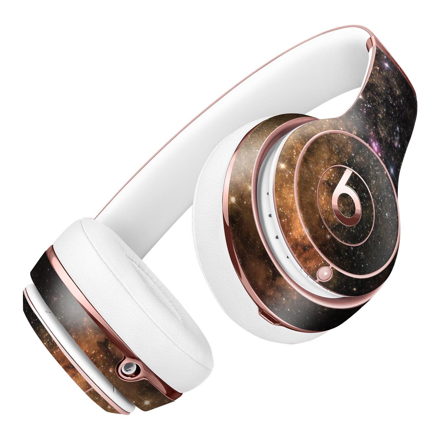 Rose gold and white headphones with a galaxy pattern on the earcups and headband.