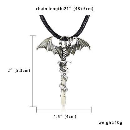 Silver bat-winged pendant with skull and snake, black cord chain. Dimensions: 2"x1.5".