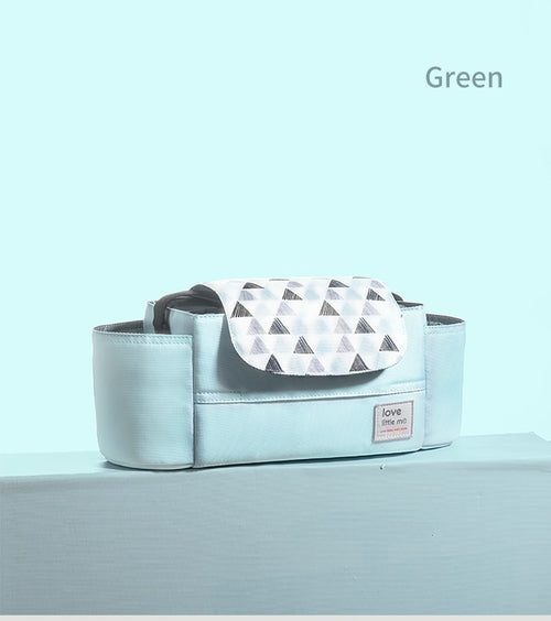 Light aqua bag with triangle-patterned flap, rectangular shape, and small front label.