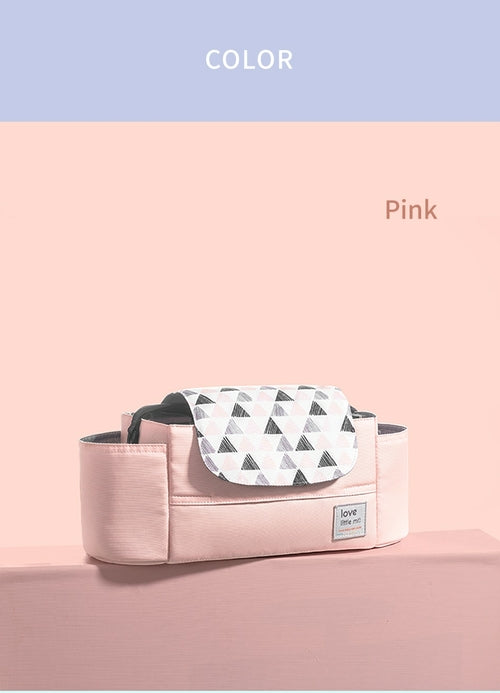 Pink bag with geometric triangle flap design, set against a pastel pink background.