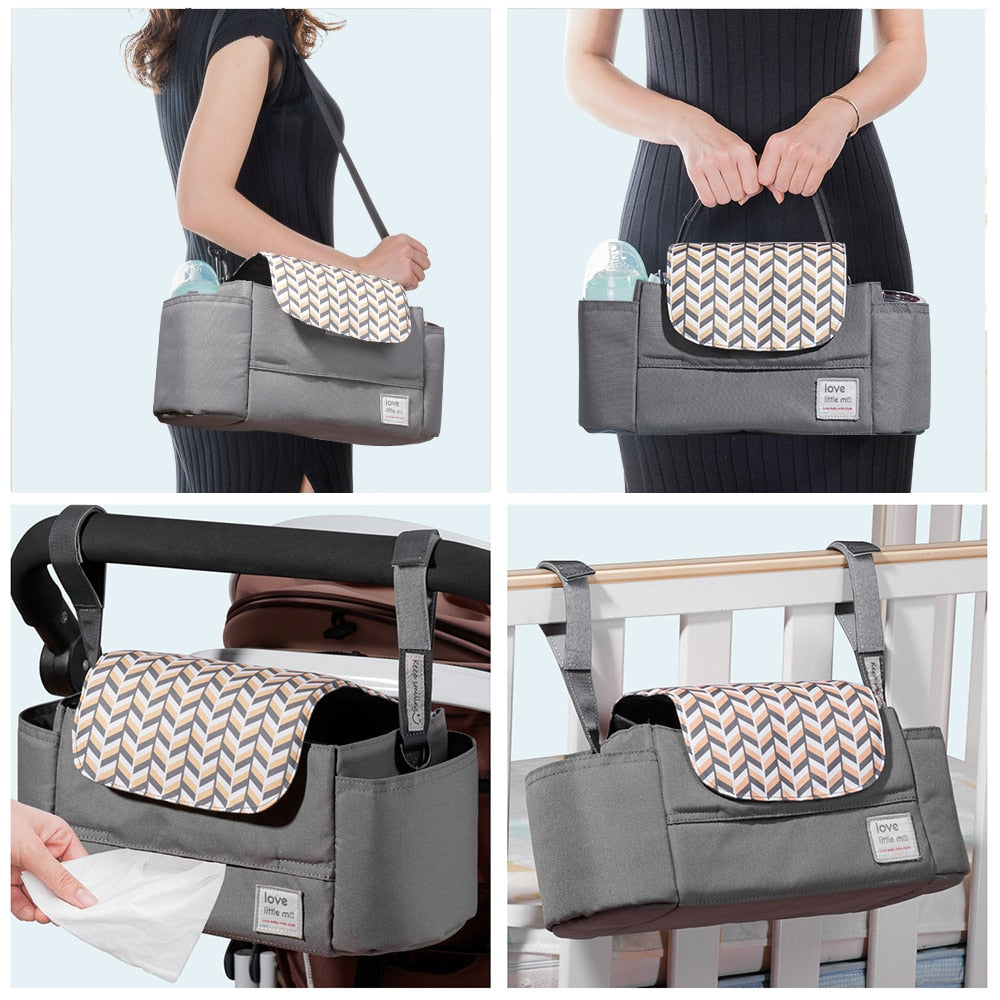 Gray diaper caddy with chevron flap, shown on shoulder, stroller, crib, and accessing tissues.