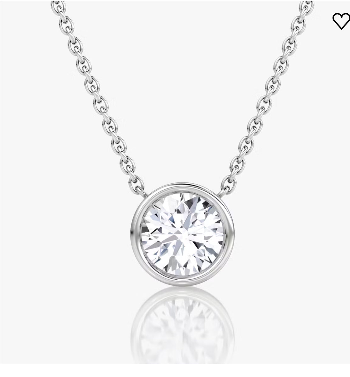Silver chain necklace with a round, sparkling diamond pendant on a white background.