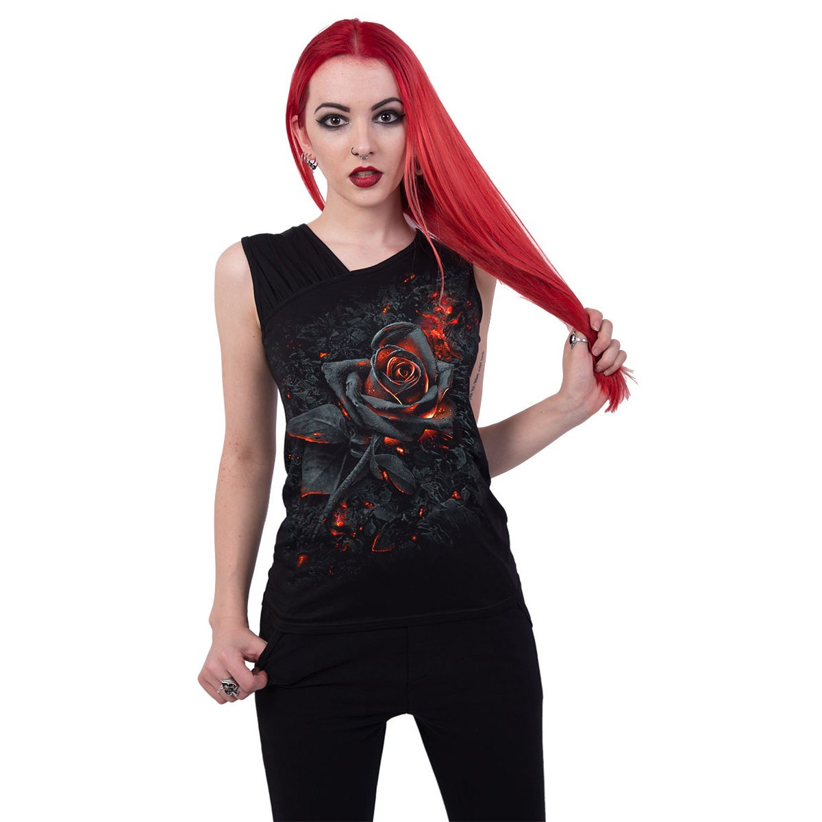 Red-haired person in a black top with a fiery rose design, holding hair to the side.