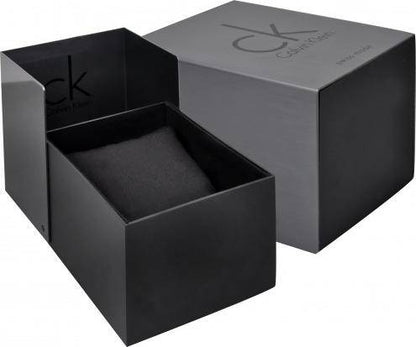 Black CK box with separate lid, revealing a cushion inside; gray CK logo on the box cover.