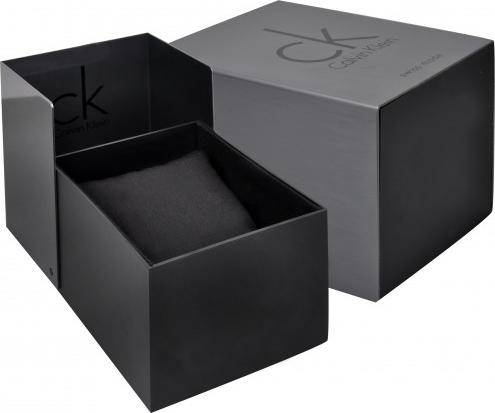 Black Calvin Klein box with a lid, featuring subtle brand logo and a black interior with cushion.