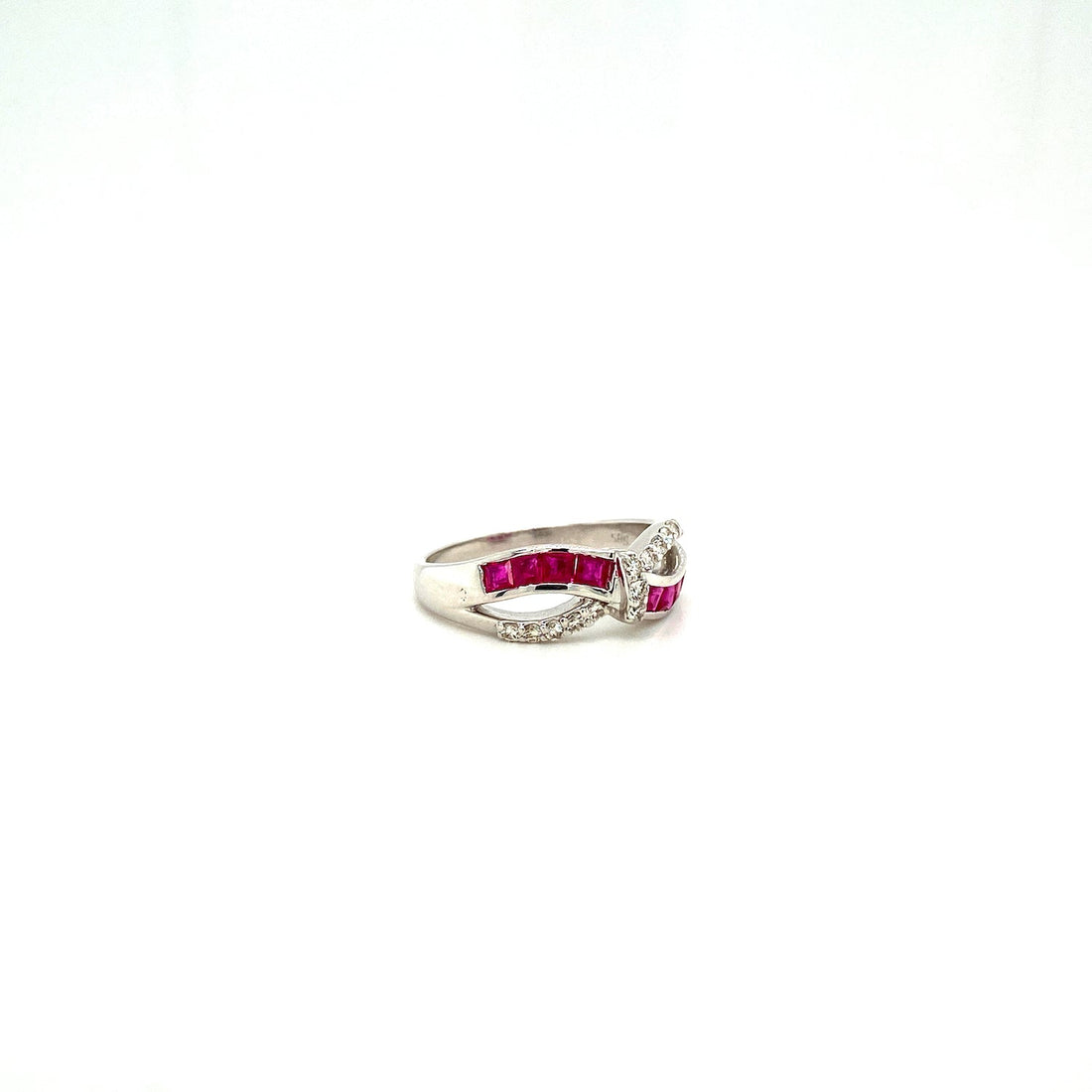 Silver ring with red rectangular stones and small white stones in a twisted design on white background.