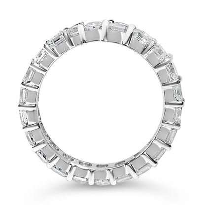 Silver ring with rectangular diamonds set all around, shown on a white background.