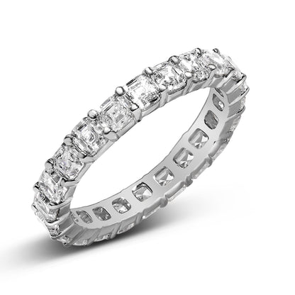 Silver ring with square-cut diamonds, arranged in a continuous band, reflecting light.