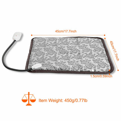 Gray floral heating pad with control, measuring 45cm square and 1.5cm thick. Weight: 450g.