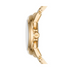 Side view of a gold watch with an MK logo on the crown and a sleek, metallic finish.