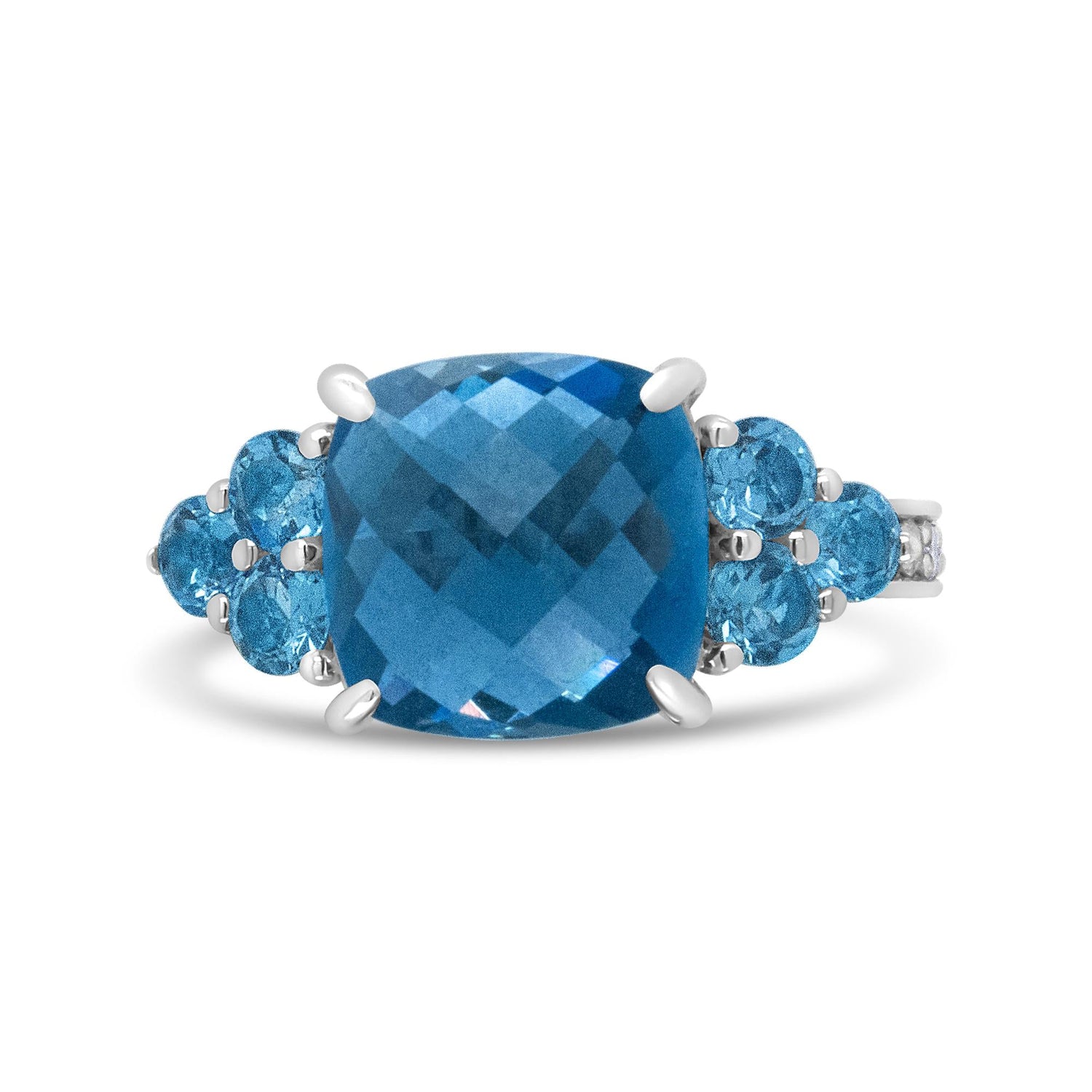 Silver ring with a large, faceted blue gemstone, flanked by smaller round blue stones.