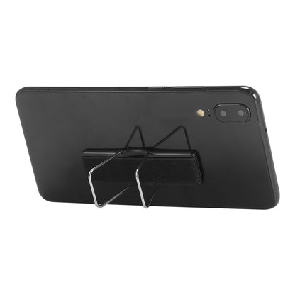 Black smartphone with dual cameras, on metal stand, viewed from the back.