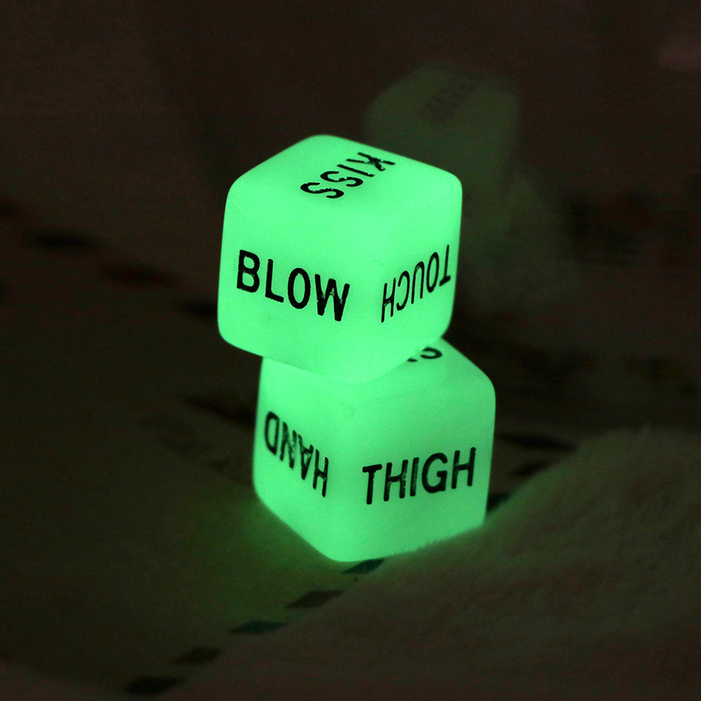 Two glowing green dice with black text reading "BLOW," "TOUCH," "HAND," and "THIGH."