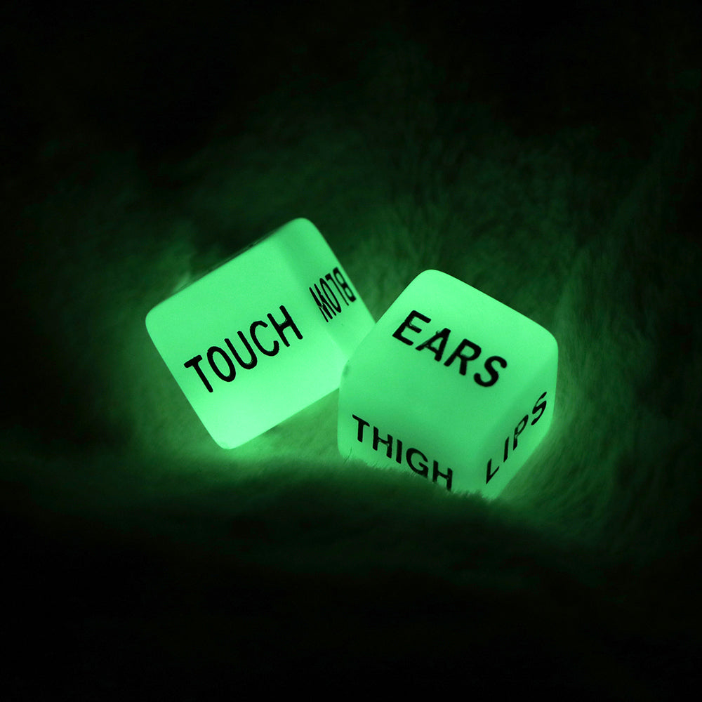 Two glowing green dice with words like "TOUCH," "EARS," and "LIPS" in black text.