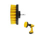 Yellow drill brush attachment with nylon bristles and a black base, shown with a yellow drill.