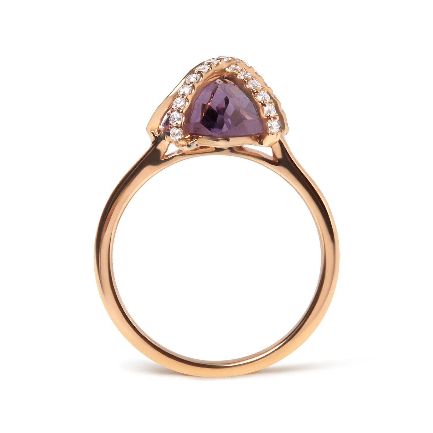 Gold ring with purple triangular stone and surrounded by small white gems.