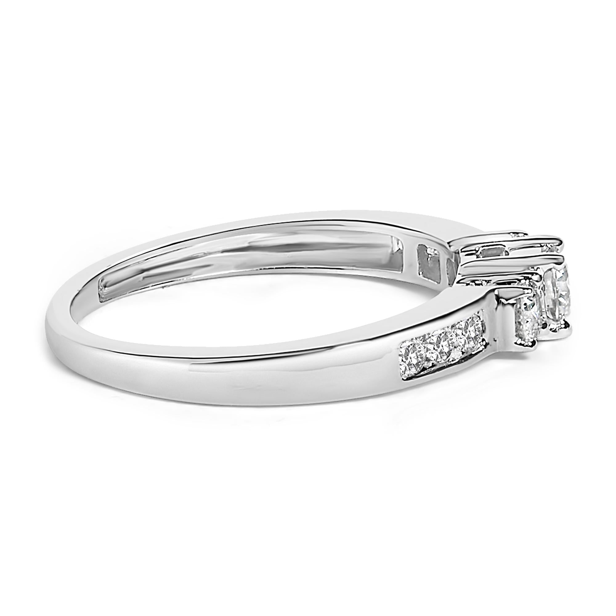 Silver ring with a row of small diamonds on the band, featuring a sleek, polished finish.