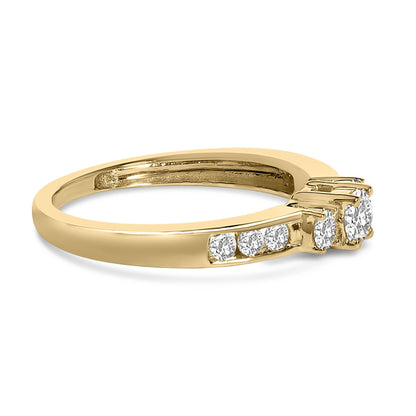 Gold ring with a row of small diamonds on the band and three larger diamonds on top.