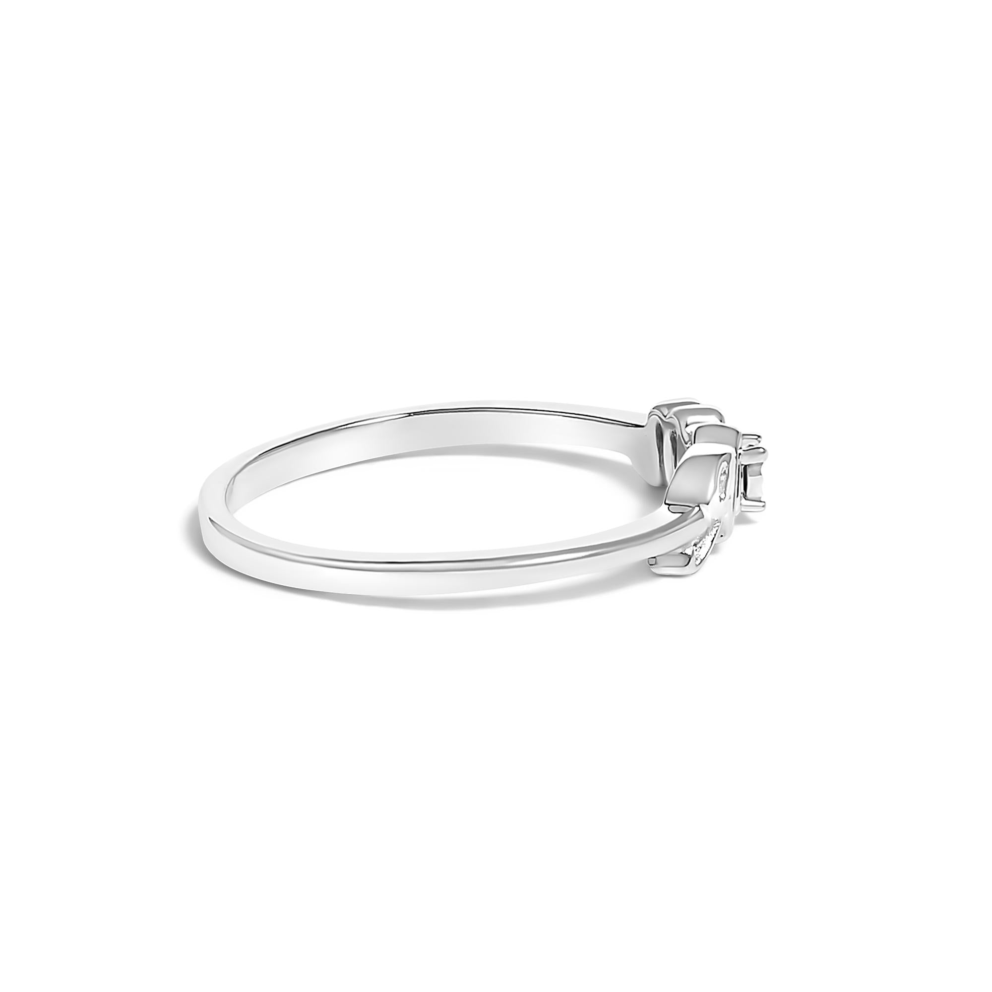 Silver ring with a small square diamond setting against a white background.