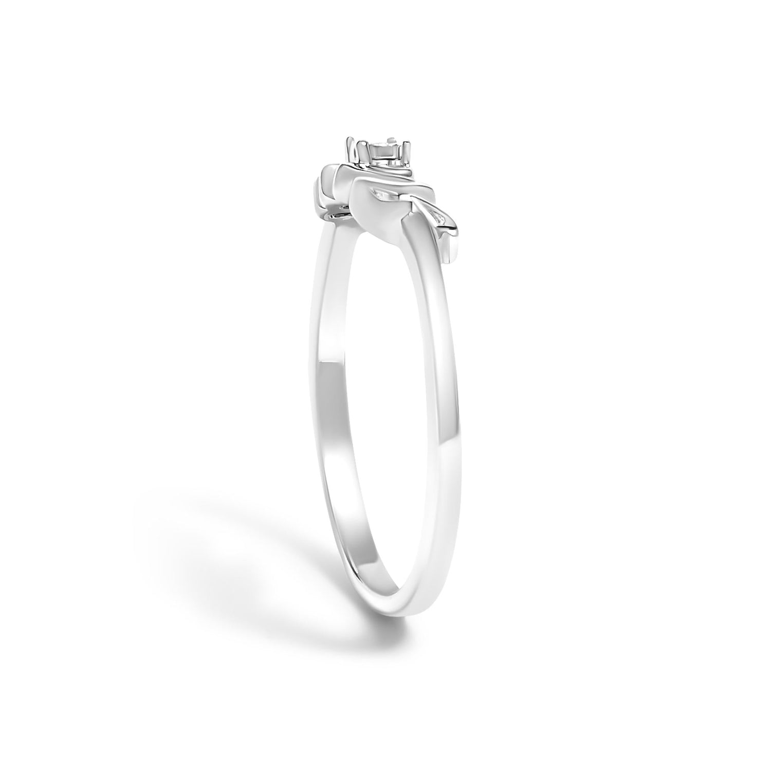 Silver engagement ring with a solitaire setting and a simple, polished band on a white background.