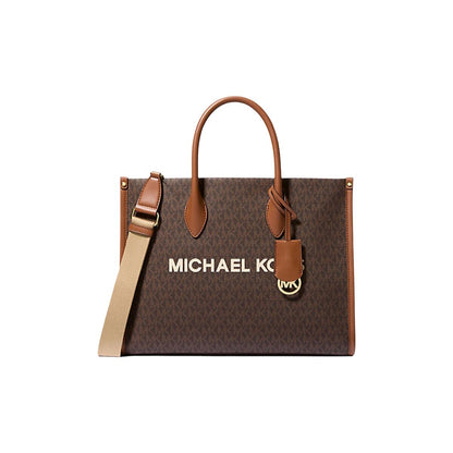 Brown handbag with tan straps, gold hardware, and "Michael Kors" text. Monogram pattern.