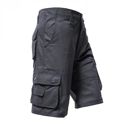 Dark gray cargo shorts with multiple pockets and button closures, made from sturdy fabric.