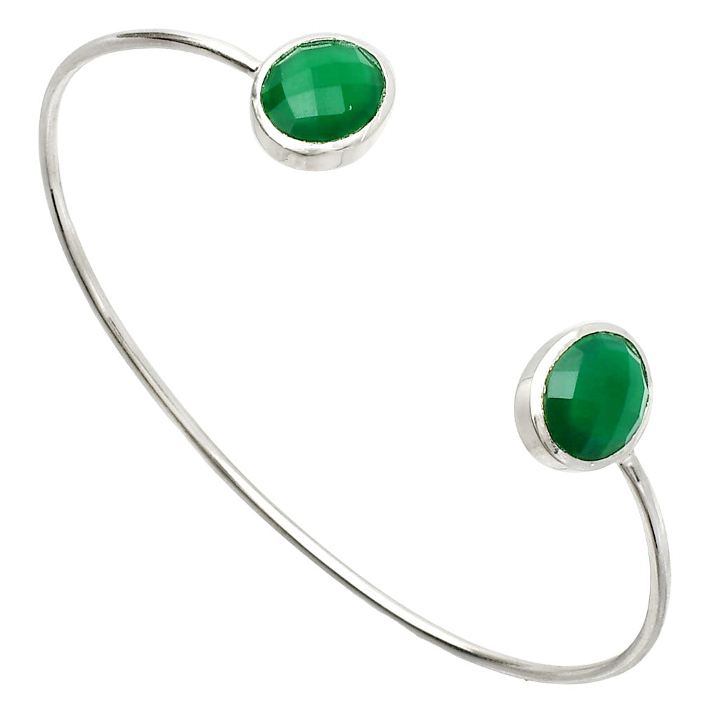 Silver open bracelet with two oval green gemstones at each end.