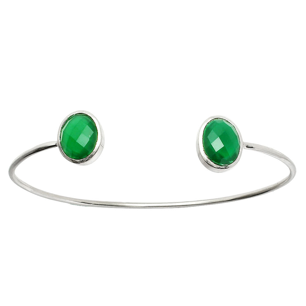 Silver open cuff bracelet with faceted oval green gemstones at each end.