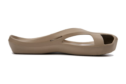 Taupe sandal with open toe, cut-out sides, and a smooth, slightly curved sole.