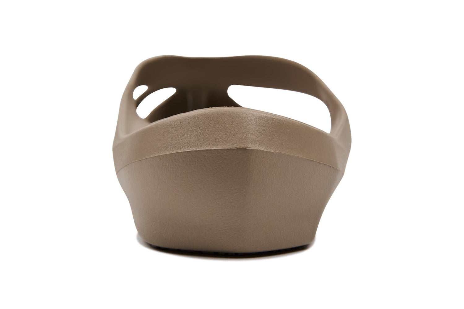 Beige clogs with side cutouts, viewed from the front, featuring a curved toe and thick sole.