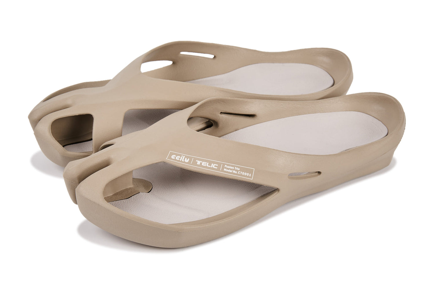 Beige sandals with a unique cutout design and a slightly elevated sole.