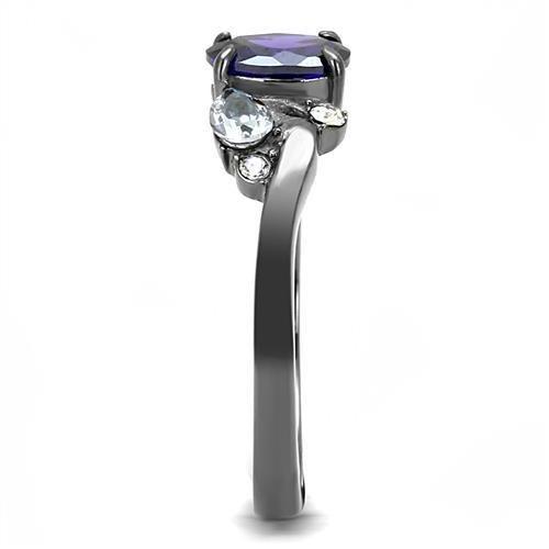 Silver ring with a purple gem, two small clear stones, and a twisted band design.