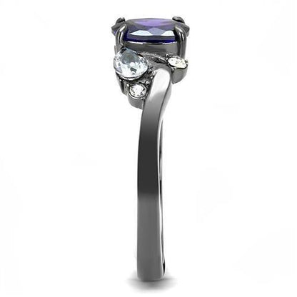Silver ring with a purple gem, two small clear stones, and a twisted band design.