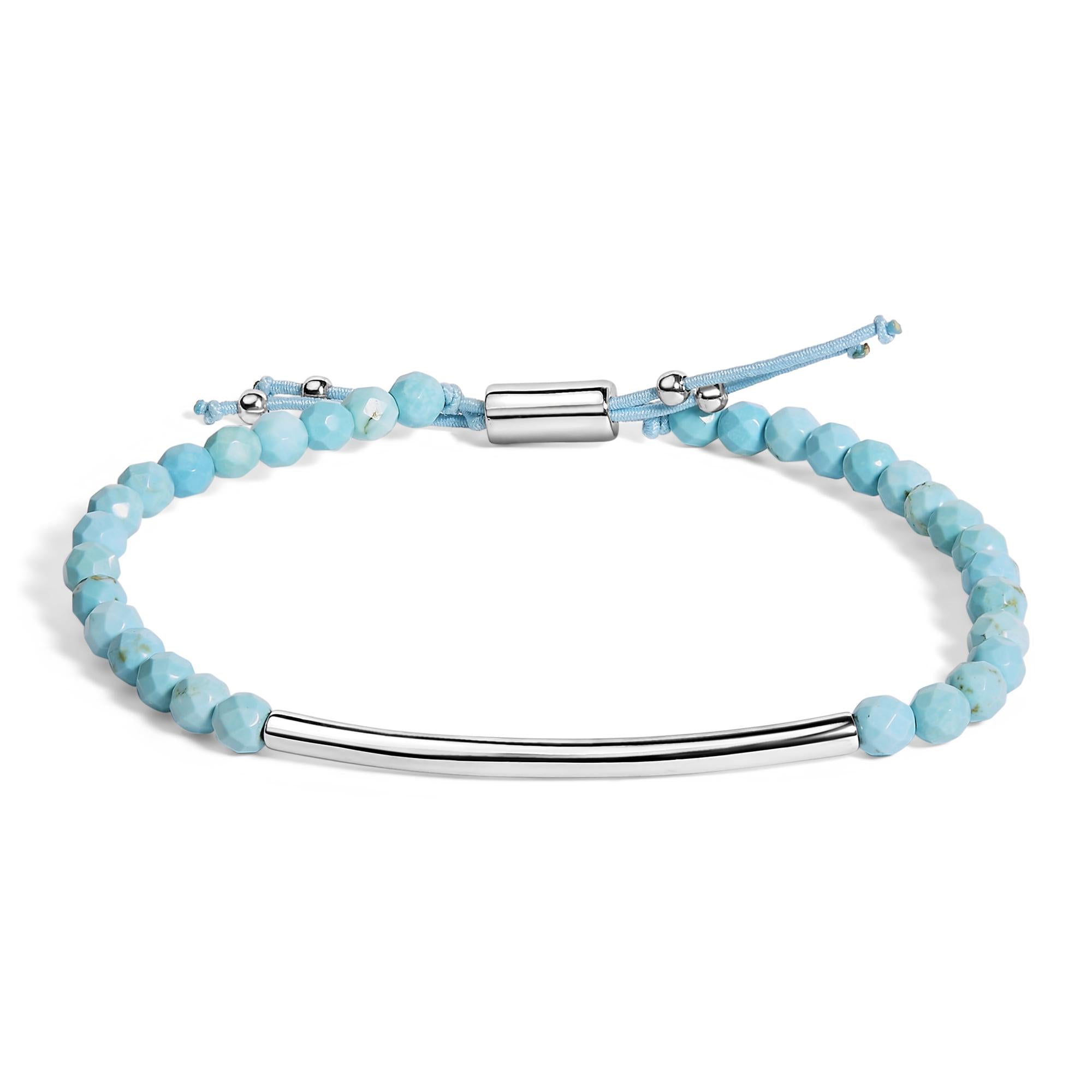 Silver bar bracelet with faceted light blue beads and adjustable cord.
