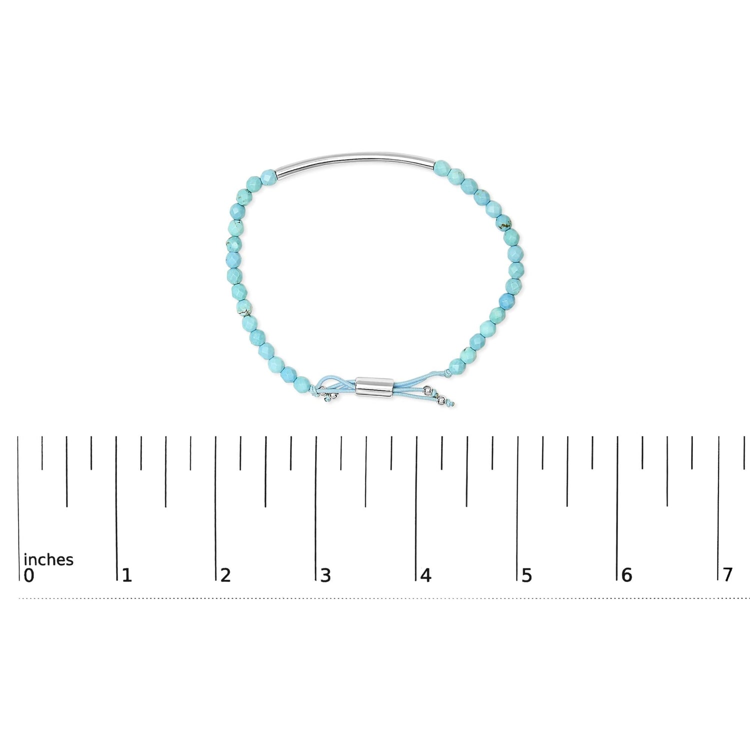 Turquoise bead bracelet with silver accents, clasp, and a ruler showing size in inches.