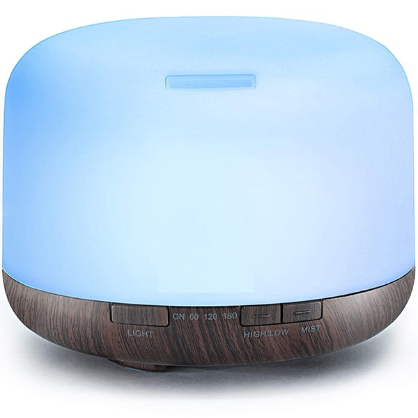 Blue diffuser with a wood-textured base, programmable buttons, and a top air vent.