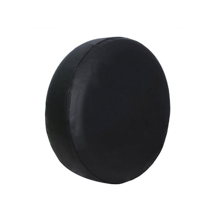 Black round cushion with smooth fabric and a simple, clean design on a white background.