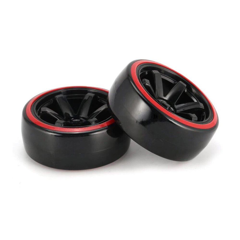 Black plastic wheels with red trim, glossy finish, and a spoke design, set against a white background.