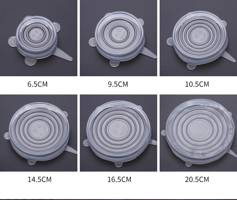 Five transparent silicone lids in different sizes with circular ridges on a dark background.