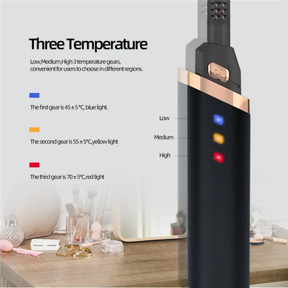 Black device with gold trim; blue, yellow, red lights for temperature settings. Makeup items nearby.