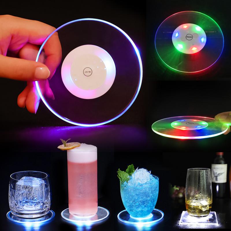 Glowing coasters with colorful LED lights under various drinks, showcasing vibrant colors.