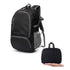 Black backpack with gray accents, mesh side pocket. Folded in hand, compact size.