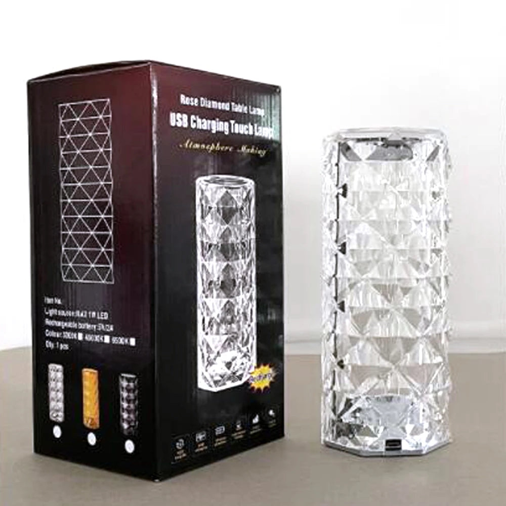 Crystal cylinder lamp with diamond pattern, next to black box featuring white text and graphics.