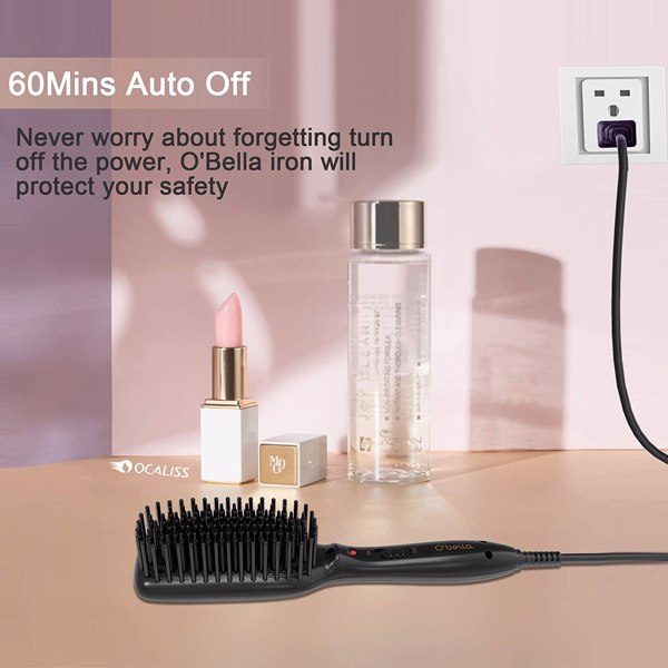 Electric hairbrush on a beige surface, near a plugged-in socket, lipstick, and a clear bottle.