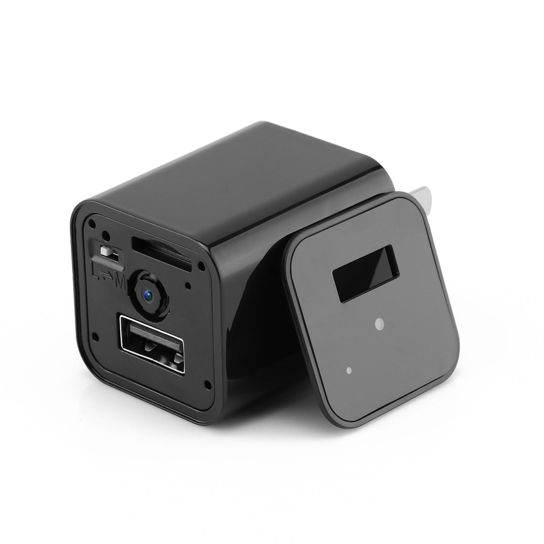 Black adapter with USB port, camera lens, and removable cover lying on a white background.