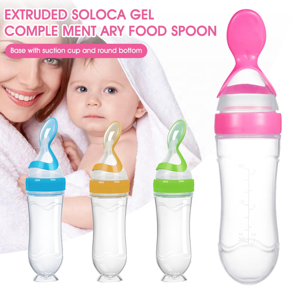 Three baby food spoons in blue, orange, and green with suction bases, and a mother with a child.
