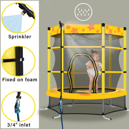 Yellow trampoline with safety net, child playing inside, overhead sprinkler system attached.