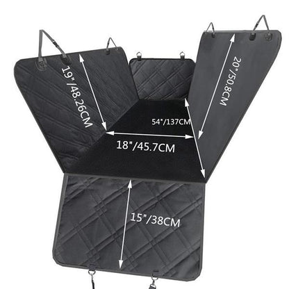 Quilted black car seat cover with measurements labeled in inches and centimeters.