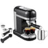 Sleek black espresso machine with two cups, milk frother, and accessories on a white background.
