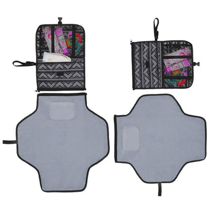 Black and white zigzag patterned pouches and gray changing pads laid out flat.